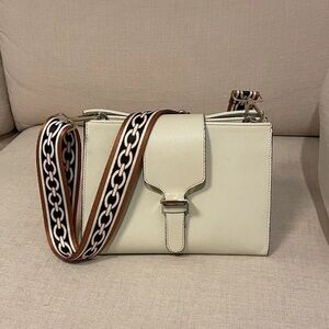 Elegant Cream Crossbody Bag with Patterned Strap